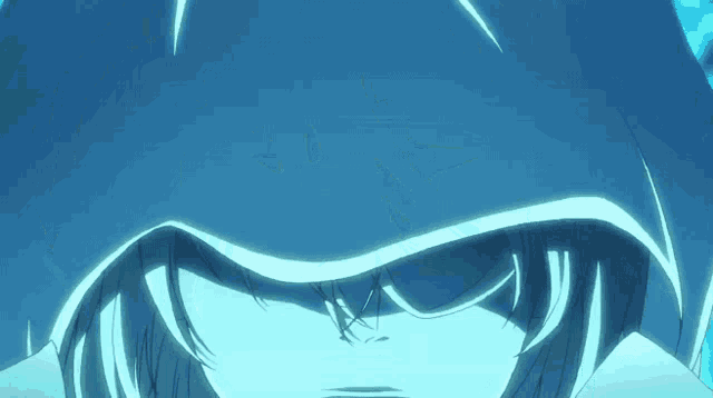 a close up of a person 's face with a hood over their head .
