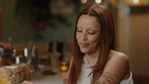 a woman with a tattoo on her arm that says ' i love you ' on it