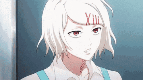 a girl with white hair and red eyes has a tattoo on her face .