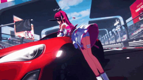 a girl standing next to a red car with a sign that says toyota on it