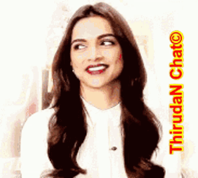 a woman with long brown hair is smiling and wearing a white shirt and necklace .