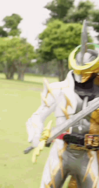 a blurred image of a person holding a sword