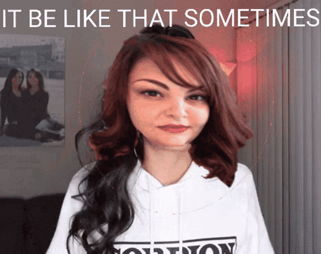 a woman with red hair is wearing a white shirt that says " solution " on it