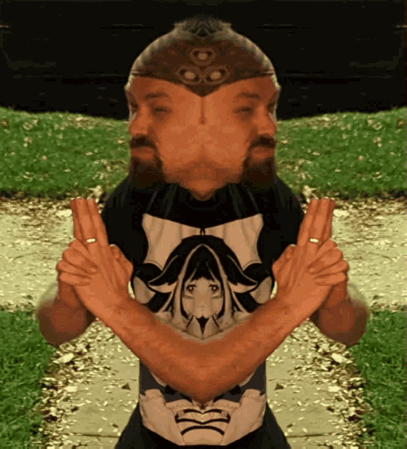 a man with a beard wearing a shirt with a girl on it crosses his arms