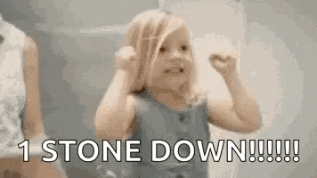 a little girl is making a funny face and saying `` 1 stone down !!! ''