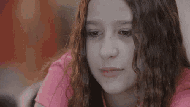 a close up of a girl making a surprised face