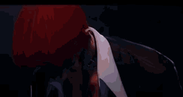 a video game character is standing in a dark room .
