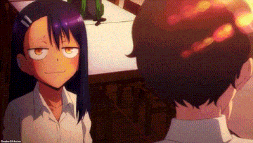 a man and a girl are looking at each other in a restaurant .