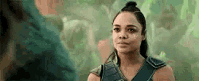a woman is crying while standing next to a man in a movie .