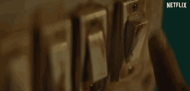 a close up of a light switch with netflix written on the bottom