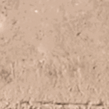 a purple object is laying on the ground with a shadow of it