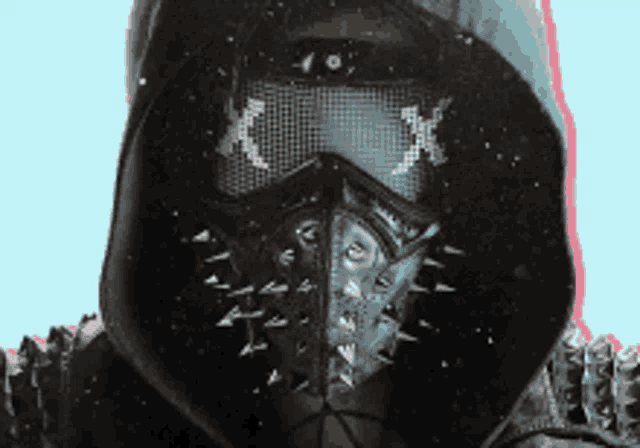 a close up of a person wearing a mask with spikes and the letter x on it