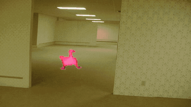 an empty room with a sticker of a pink chicken on the floor