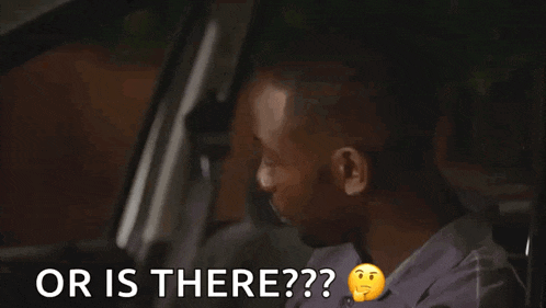 a man sitting in a car with the words " or is there " behind him