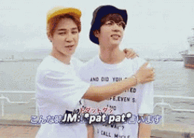 two young men are hugging each other and one of them is wearing a white shirt that says " and did you "