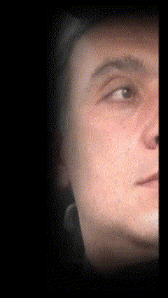 a close up of a man 's face with his eyes closed