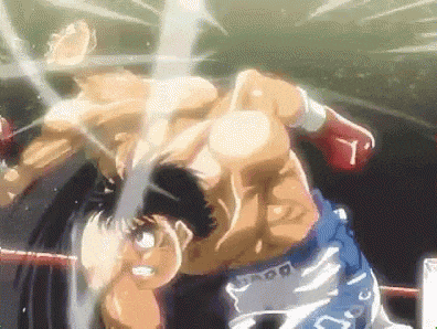 two men are fighting in a boxing ring and one of them is wearing shorts that say ' ss ' on them .