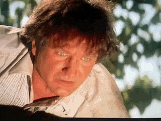 a close up of a man 's face in a movie