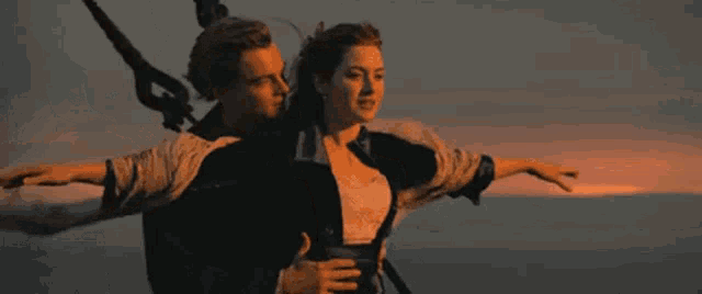 a man and a woman are flying in the air with #zo written in white