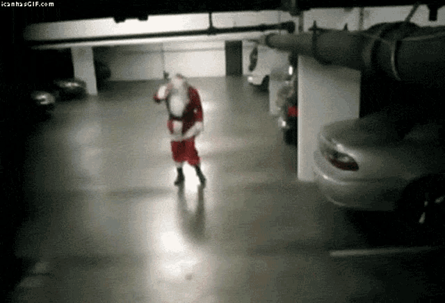 santa claus is dancing in a parking garage with cars