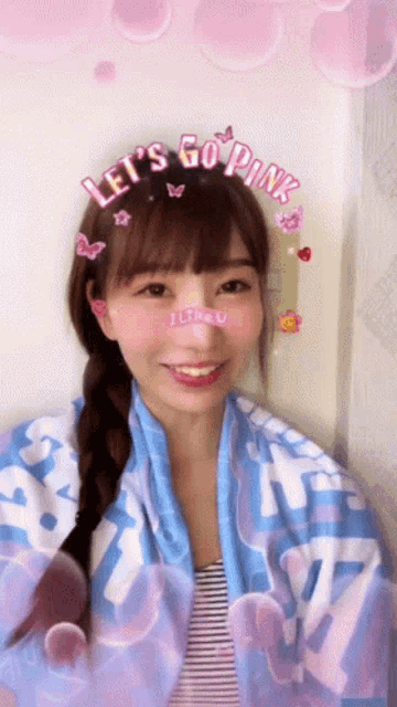 a girl wearing a headband that says let 's go pink on it