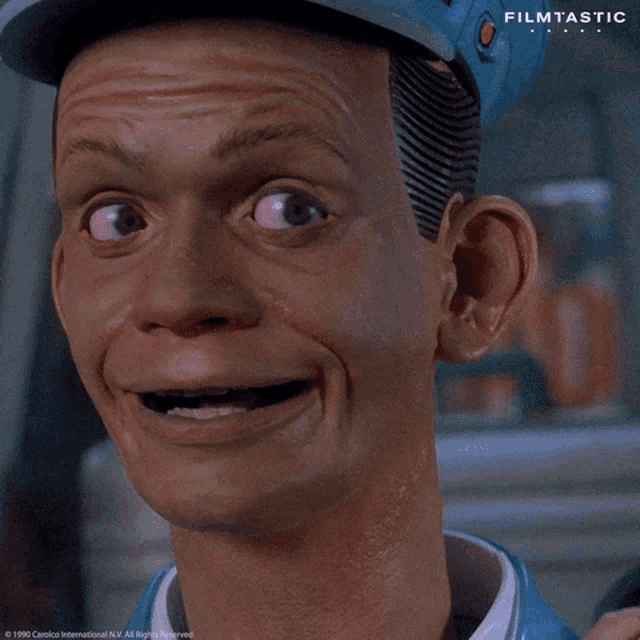 a close up of a man 's face with filmtastic written below it