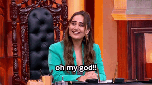 a woman in a green jacket is sitting in a chair with the words oh my god written below her