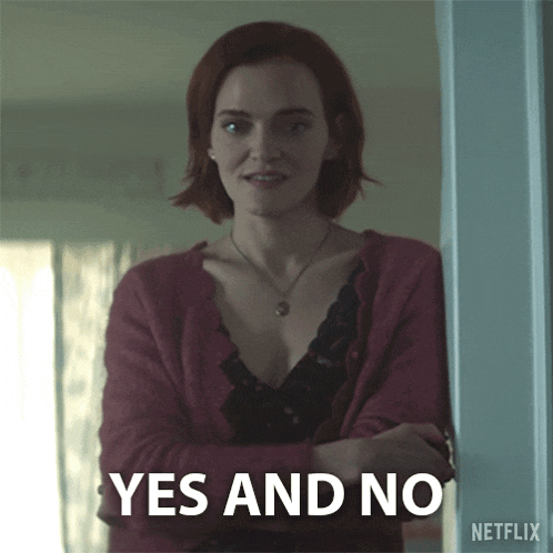 a woman in a red cardigan stands in front of a sign that says " yes and no "