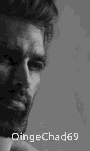 a black and white photo of a man with a beard and the name oingechad69