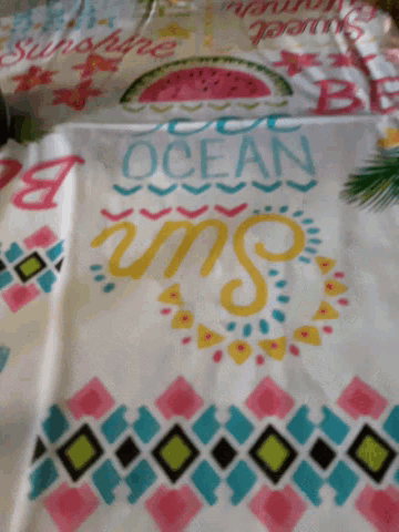 a colorful blanket with the words ocean sun and watermelon on it