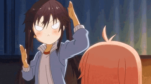 a girl is giving another girl a high five