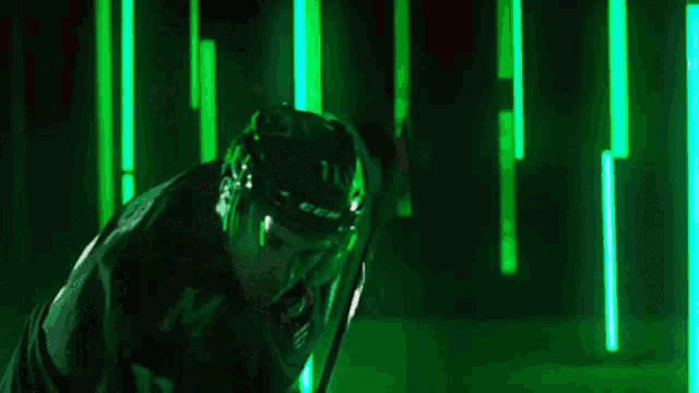 a hockey player with the word goal in red