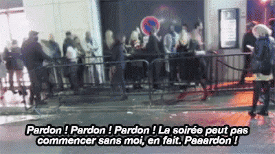 a group of people standing in front of a fence with the words " pardon " on the bottom