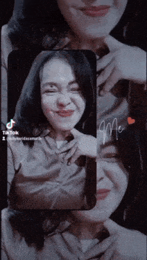 a woman 's face is displayed on a phone screen with the words " me " written on it