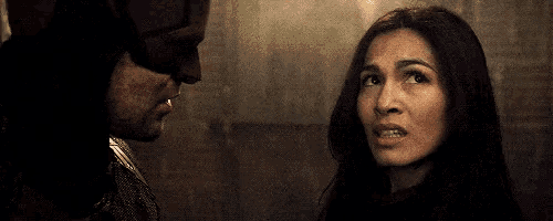 a man and a woman are looking into each other 's eyes