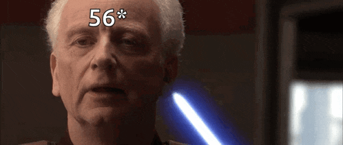 a close up of a man 's face with the number 56 on it