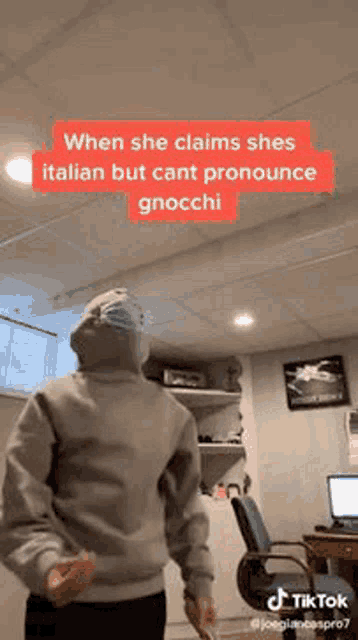 a person wearing a mask is dancing in a room .