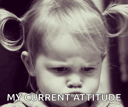 a little girl with pigtails has a serious look on her face and the caption says " my current attitude "