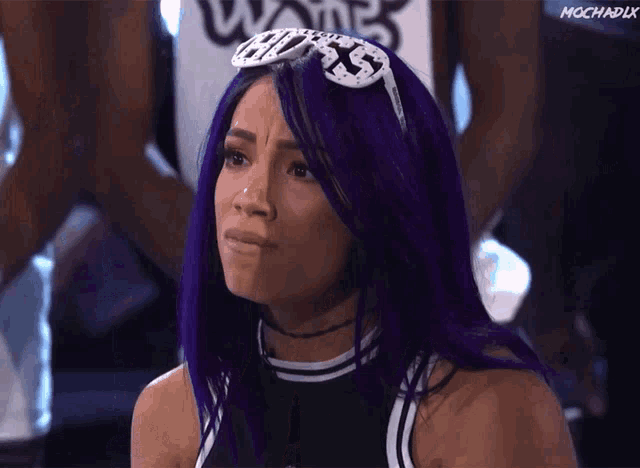a woman with purple hair wearing sunglasses that say boss