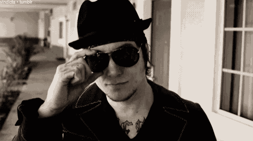 a black and white photo of a man wearing sunglasses