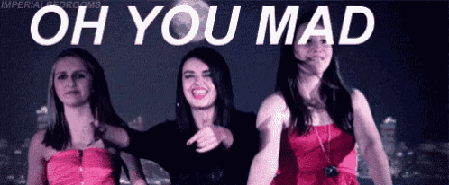 three women are standing next to each other with the words oh you mad written above them .