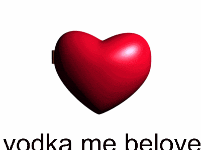 a heart shaped mirror with a bottle of absolut vanilla in it