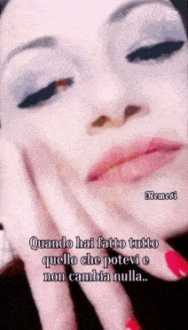 a close up of a woman 's face with the words nemesi on the bottom right