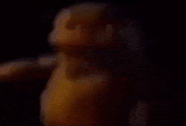 a close up of a person 's face in a dark room .