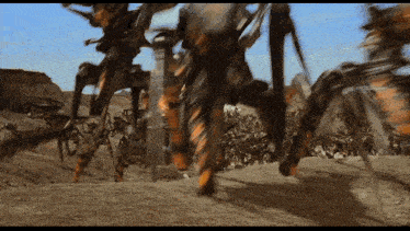 a group of robots are walking across a desert