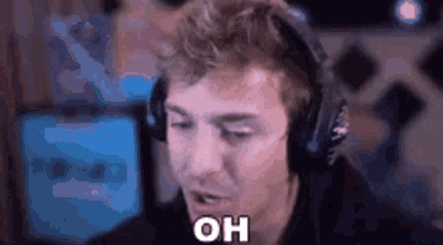 a man wearing headphones is saying `` oh '' .