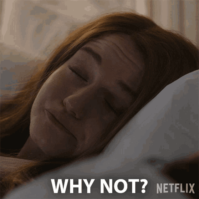 a woman is laying in bed with her eyes closed and the words why not netflix behind her