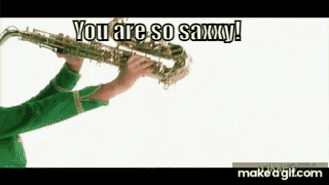 a man in a green sweater is playing a saxophone and saying you are so saxxy .