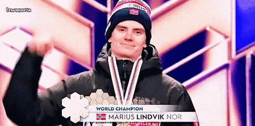 a man wearing a medal that says world champion on it