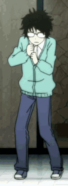 a boy wearing glasses and a blue sweater is standing in front of a wall